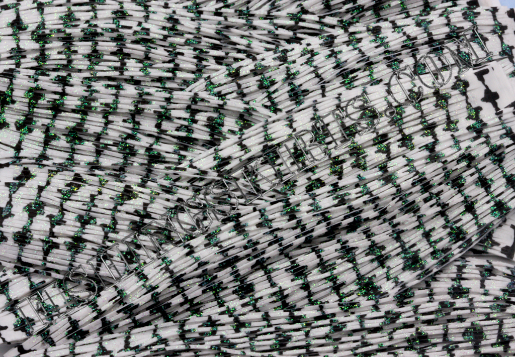 Featured image for “White Barbed Wire Green Glitter”